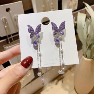 Elegant butterfly pearl chain earrings with purple glitter butterflies and dangling pearls. Perfect.
